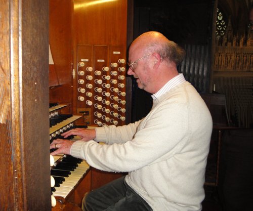 At the console of a large Cathedral organ